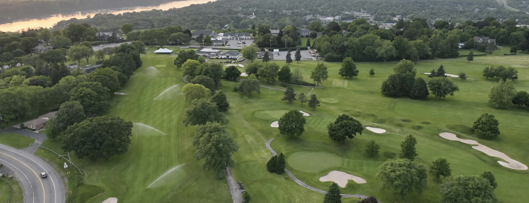 Aerial view across Niagara Falls Country Club toward the river, with illustrative irrigation added along the fairway.